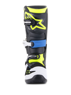 Alpinestars Stivali Youth Tech 7S, stivali da motocross, nero, blu smalto e giallo fluorescente, vista frontale con robusto sistema di chiusura a fibbie multiple, protezione punta bianca e vivace logo Alpinestars giallo fluorescente sulla placca tibiale.