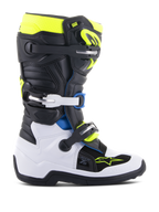 Stivali Alpinestars Youth Tech 7S, stivali da motocross per giovani piloti, nero, bianco e giallo fluo con accenti blu, dotati di sistema a fibbie regolabili, pannelli di protezione rinforzati e suola ad alta aderenza per gare fuoristrada