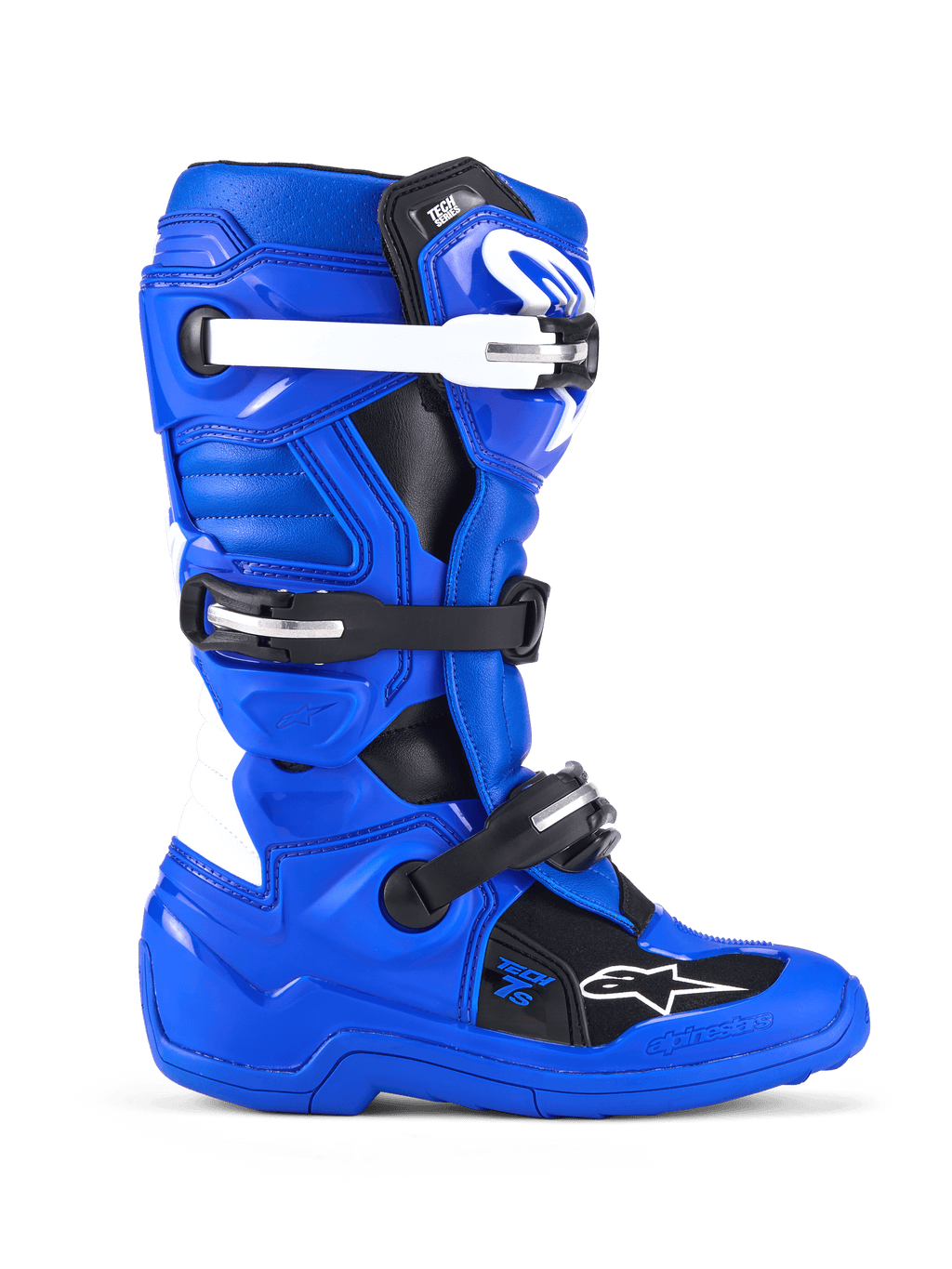 Alpinestars Youth Tech 7 S, stivali da motocross, blu, nero e bianco, vista laterale con tomaia in microfibra rinforzata in PU, sistema di chiusura a quattro fibbie con cinturini bianchi e neri, placca tibiale in TPU e logo Alpinestars, calzature protettive da fuoristrada per giovani piloti
