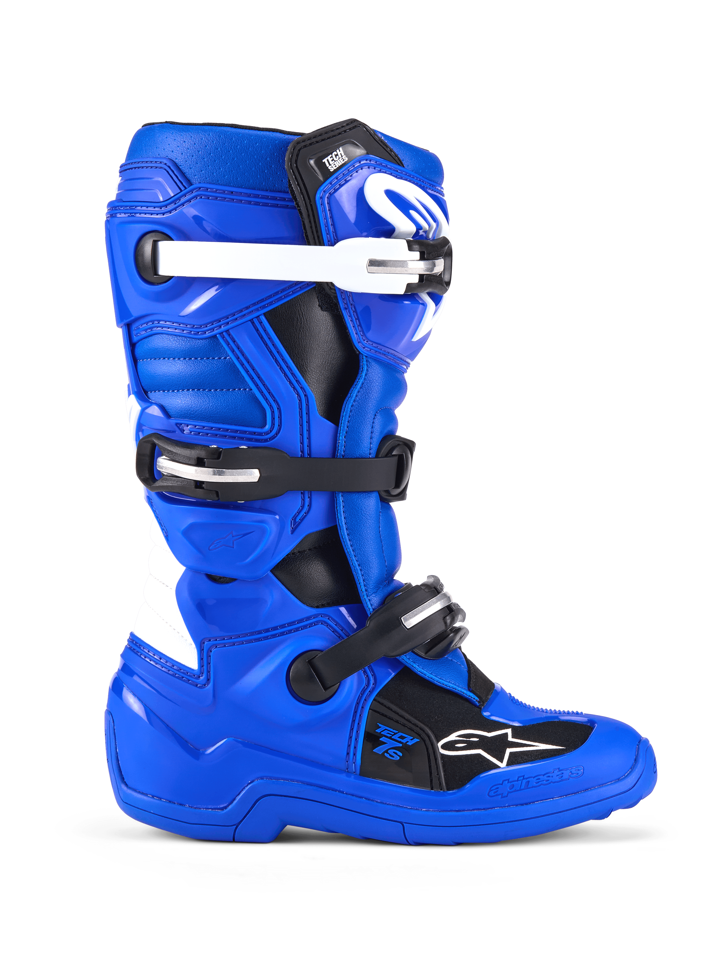 Alpinestars Youth Tech 7 S, stivali da motocross, blu, nero e bianco, vista laterale con tomaia in microfibra rinforzata in PU, sistema di chiusura a quattro fibbie con cinturini bianchi e neri, placca tibiale in TPU e logo Alpinestars, calzature protettive da fuoristrada per giovani piloti