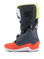 Stivali Alpinestars Youth Tech 7S, stivali da motocross, grigio scuro con accenti rossi e giallo fluorescente, vista laterale, suola bianca, marchio 'TECH SERIES' e pannelli protettivi in TPU resistente