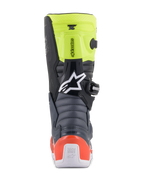 Stivali Alpinestars Youth Tech 7S, stivali da motocross per ragazzi, grigio scuro, rosso fluo e giallo fluo, vista posteriore con zone di flessione a soffietto, protezione del tallone rossa e logo Alpinestars bianco