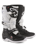 Stivali Alpinestars Youth Tech 7S, stivali da motocross, nero e bianco, con sistema di chiusura a fibbie regolabili, parastinchi in TPU e sistema pivot, costruzione robusta con suole spesse tassellate per la guida fuoristrada