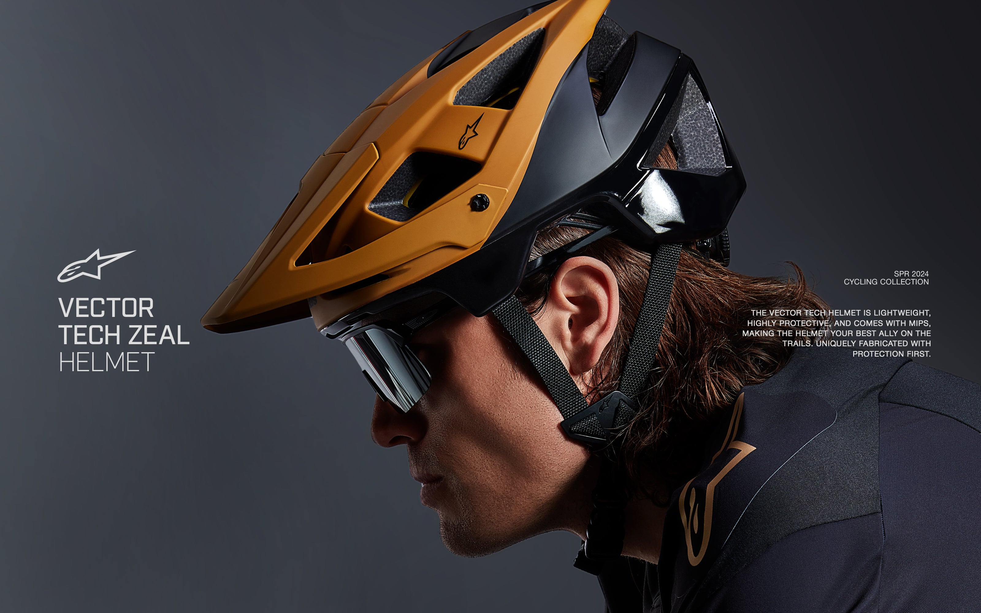Alpinestars Vector Tech Zeal Helmet, Black and Dark Gold MTB cycling helmet with Mips, worn by a male rider in profile.