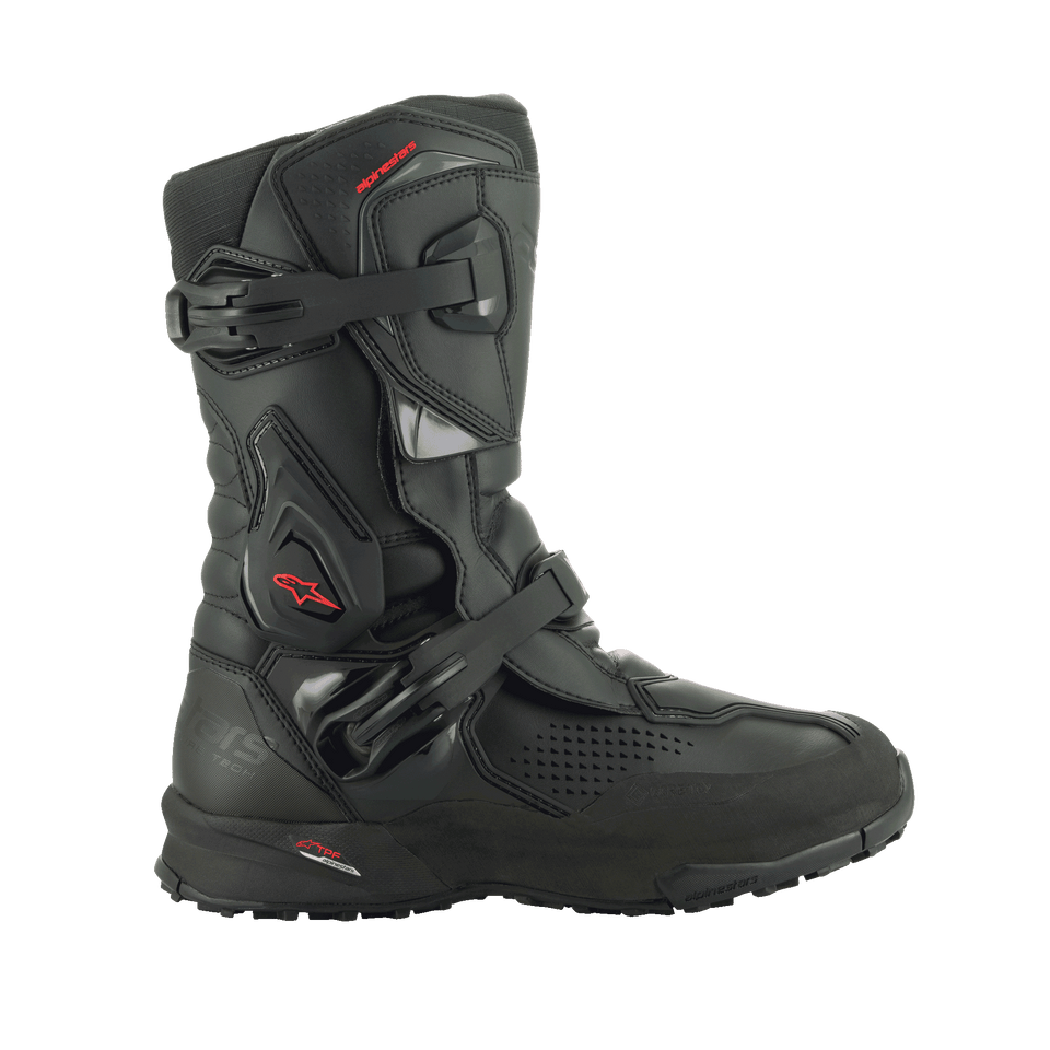 A pair of black/black XT-8 Gore-Tex high-top adventure enduro boots by Alpinestars EU, featuring red detailing. These boots boast a reinforced design with protective buckles and a rugged sole for enhanced grip. The Alpinestars logo is visible on the side, and the durable material makes them perfect for off-road riding.