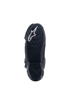 Stivali Alpinestars Supertech R, stivali da moto racing, nero, vista dal basso della suola in mescola di gomma con motivi di grip testurizzati e logo a stella Alpinestars bianco sul tallone