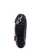 Stivali Alpinestars Supertech R, vista della suola, mescola in gomma leggera nera con motivo grip testurizzato, logo a stella Alpinestars bianco, calzature tecniche per competizioni motociclistiche