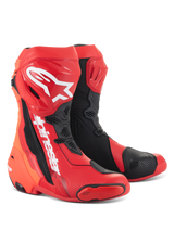 Stivali Alpinestars Supertech R, stivali da moto racing, rosso brillante e rosso fluo con dettagli neri e bianchi, con loghi Alpinestars bianchi sulla tibia, placche protettive rinforzate e slider della punta sostituibili, calzature ad alte prestazioni per sport e racing.