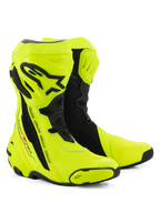 Stivali Alpinestars Supertech R, stivali racing da moto, giallo fluo e nero, con placca tibiale protettiva e logo Alpinestars, pannelli flessibili a soffietto e slider punta rinforzati su sfondo bianco