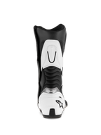 Stivali Alpinestars SMX S, nero e bianco, vista posteriore che mostra il contrafforte del tallone bianco con logo a stella nero, pannelli flessibili a fisarmonica e rinforzo superiore del polpaccio bianco, stivali da moto sportivi in microfibra resistente