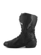 Alpinestars Stivali Stella SMX-6 V3 Drystar®, stivali da moto impermeabili da donna, nero e argento, vista laterale con protezioni per stinco e caviglia in TPU, logo Drystar in rilievo, costruzione in microfibra resistente per guida sportiva e stradale.