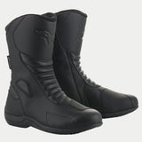 Stivali Alpinestars Origin Drystar®, stivali da moto touring impermeabili, nero, con tomaia in microfibra, zone flex a soffietto anteriori e posteriori, pad cambio sintetico e logo goffrato, progettati per la guida su strada e adventure