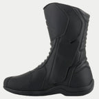 Stivali Alpinestars Origin Drystar®, stivali da moto touring neri, vista laterale del lato mediale che mostra l'aletta del sistema di ingresso, tomaia in microfibra con zone a soffietto anteriori e posteriori, design impermeabile per guida su strada e adventure