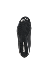 Scarpe Alpinestars Celer, scarpe da moto, nero bianco, vista della parte inferiore della suola in gomma resistente all'olio con motivo di aderenza testurizzato e marchio Alpinestars bianco.