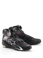 Scarpe Alpinestars Celer Superair, calzature da moto, nero e bianco, con sistema di chiusura Rotor sulla linguetta, logo a stella bianca su tomaia in tessuto traspirante e design sportivo a basso profilo.