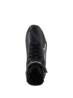 Scarpe Alpinestars Faster-4, scarpe da moto, nero e bianco, vista dall'alto con chiusura a lacci, cinturino a strappo sulla caviglia e logo Alpinestars bianco sul lato