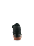 Scarpe Alpinestars Stated, scarpe da moto urbane Black Gum, vista posteriore con suola in gomma vulcanizzata, tomaia in camoscio nero e tela, colletto della caviglia in maglia a coste
