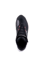 Scarpa da moto Alpinestars CR-X Women's Drystar, nero, bianco e Diva Pink, vista dall'alto con tomaia tecnica in ripstop, accenti rosa sugli occhielli dei lacci e marchio Alpinestars sul cinturino alla caviglia e sul lato.
