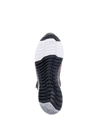 Alpinestars CR-X Women's Drystar® Riding Shoe, scarpa da moto, vista dal basso della suola, con logo TPF Transversal Protection Frame sulla punta bianca, battistrada nero multidirezionale e tallone grigio con logo a stella