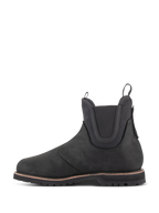 Alpinestars Scarpe Turnstone, stivale da moto nero in stile Chelsea, vista laterale di profilo, realizzato in pelle bovina da 1,5 mm con pannelli elastici sulla caviglia e linguette anteriori e posteriori