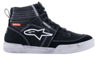 Alpinestars Ageless Riding Shoes, scarpe da moto urbane, nero e bianco, silhouette sneaker alta con pannelli in scamosciato e tela, cuciture bianche a contrasto, logo A-star bianco sul lato e suola in gomma bianca