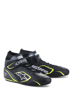 Scarpe Alpinestars Tech-1 T V3 FIA, scarpe per automobilismo, nero, grigio freddo e giallo fluo, struttura interamente in pelle con cinturino a strappo, dettagli giallo fluo, loghi bianchi Alpinestars e ASTARS in evidenza, design professionale da motorsport