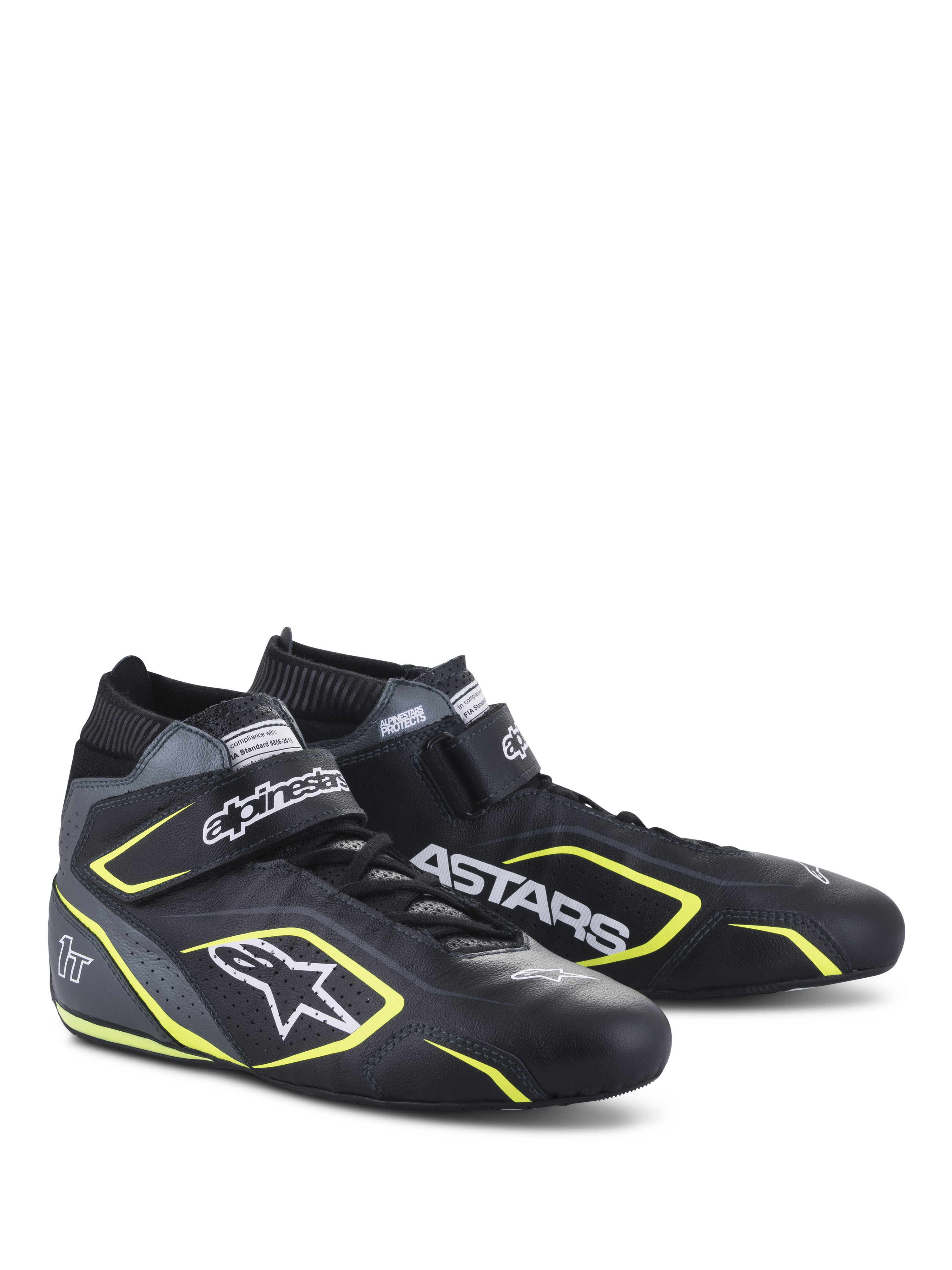 Scarpe Alpinestars Tech-1 T V3 FIA, scarpe per automobilismo, nero, grigio freddo e giallo fluo, struttura interamente in pelle con cinturino a strappo, dettagli giallo fluo, loghi bianchi Alpinestars e ASTARS in evidenza, design professionale da motorsport