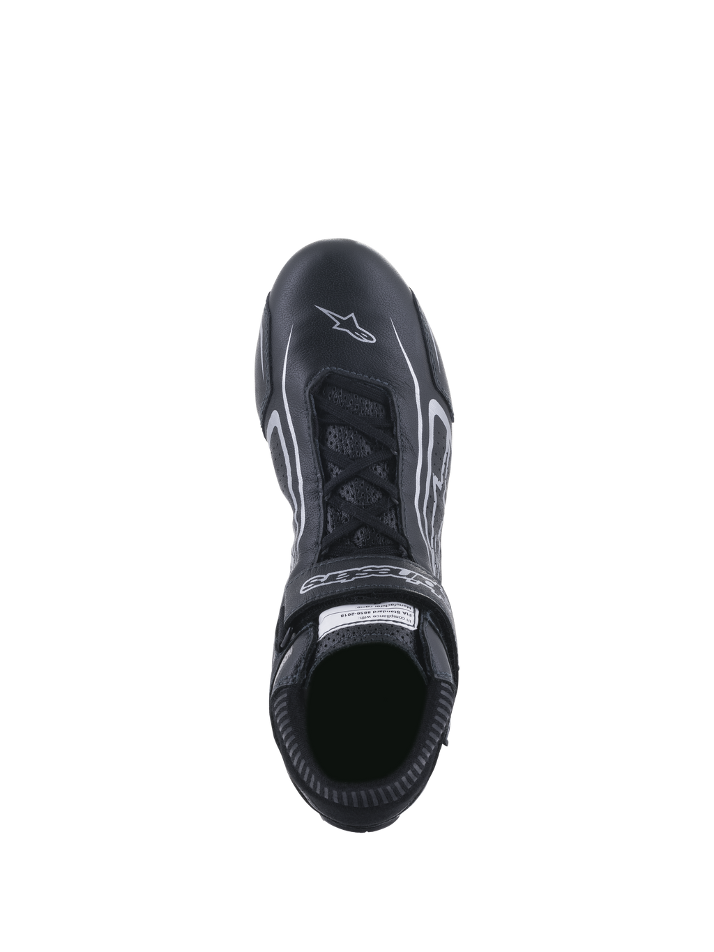 Scarpe Alpinestars Tech-1 T V3 FIA, scarpe da corsa, nero e argento, vista dall'alto del sistema di allacciatura e del cinturino a strappo con marchio, pelle bovina pieno fiore con logo a stella bianco sulla punta, calzatura professionale da motorsport