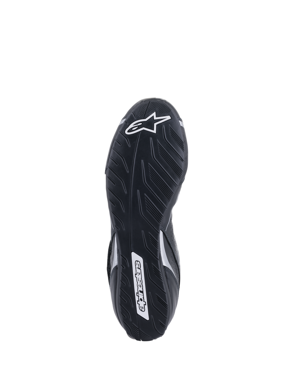 Scarpe Alpinestars Tech-1 T V3 FIA, vista della suola, nero e argento, suola asimmetrica in gomma con disegno del battistrada, logo Alpinestars bianco, mescola sottile per la sensibilità sui pedali