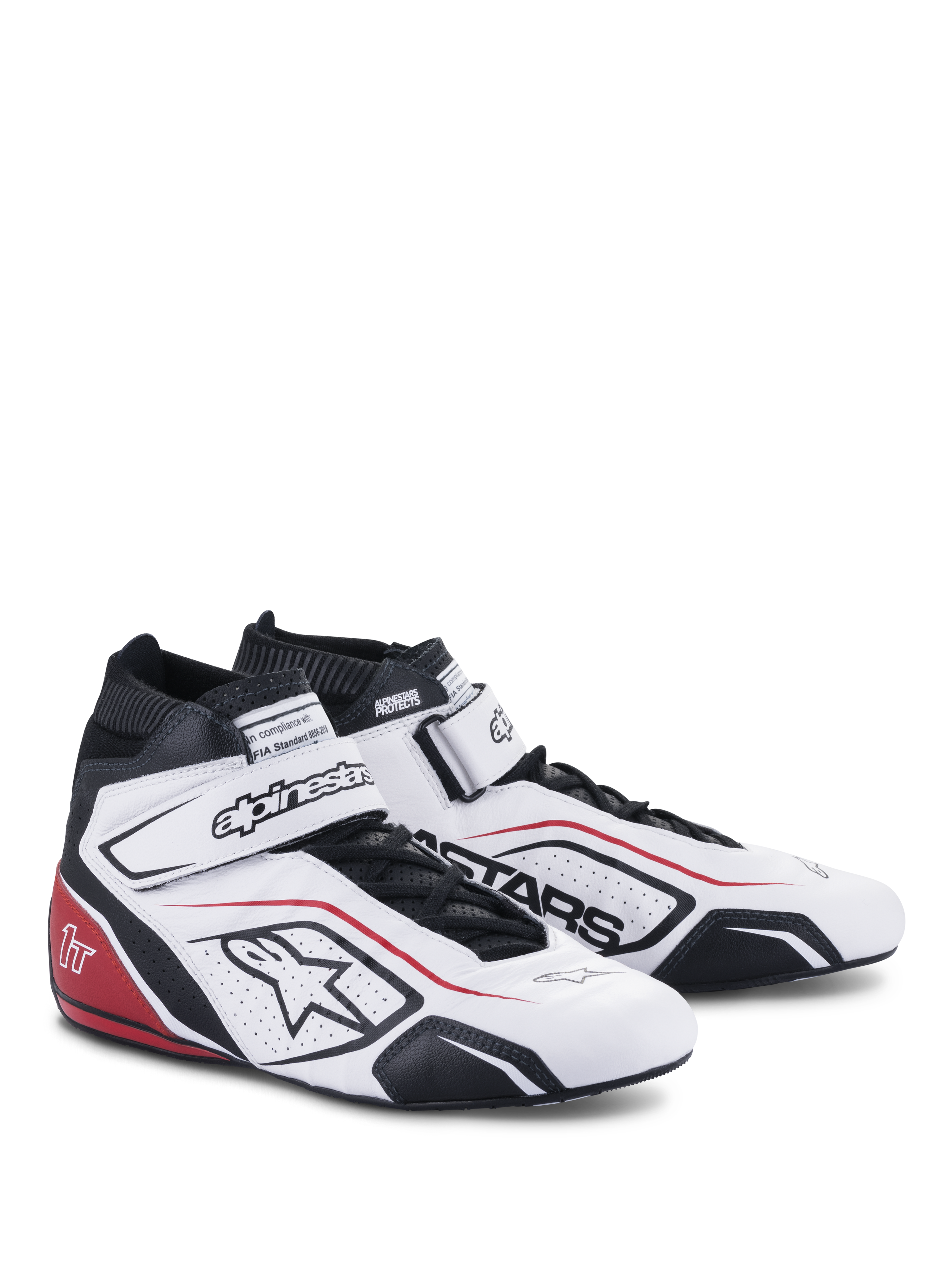 Scarpe Alpinestars Tech-1 T V3 FIA, calzature da corsa automobilistica, bianco con accenti neri e rossi, tomaia in pelle pieno fiore, cinturino alla caviglia regolabile a strappo, pannelli laterali traforati con logo Astars e design professionale da gara.