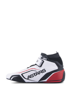 Scarpe Alpinestars Tech-1 T V3 FIA, calzature professionali per corse automobilistiche, bianco, nero e rosso, vista di profilo con marchio ASTARS su pelle traforata, colletto ignifugo nero e dettagli rossi sul tallone, design motorsport ad alte prestazioni.