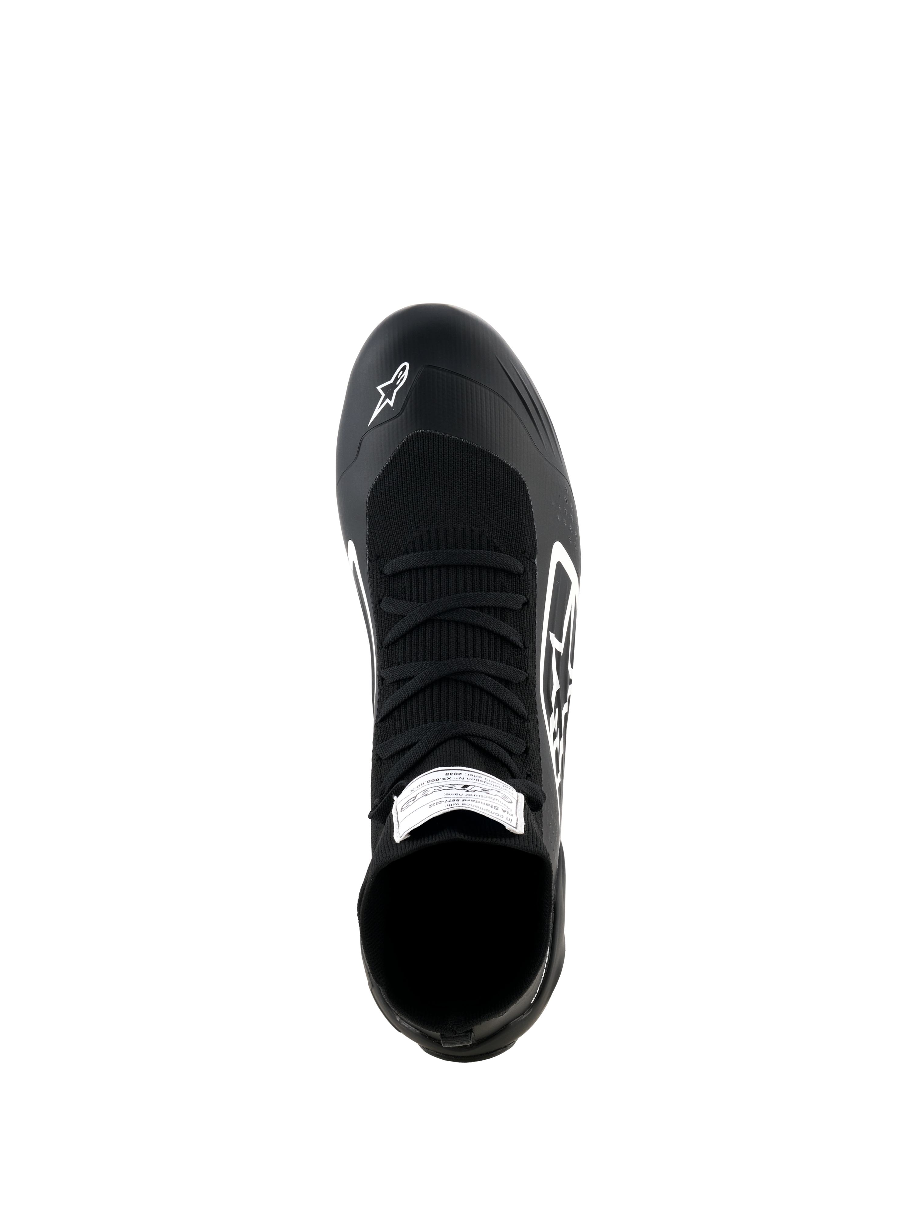 Alpinestars Supertech K Shoes, scarpe da karting, nero e bianco, vista dall'alto con tomaia completamente in maglia e lacci neri, logo Alpinestars bianco sulla punta ed etichetta di certificazione FIA sulla linguetta