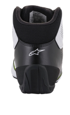 Scarpe Alpinestars Tech-1 K Start V2, scarpe da karting, bianco, nero e giallo fluo, vista posteriore che mostra il contrafforte ergonomico nero con logo a stella bianco, il collare imbottito e la suola in gomma resistente per prestazioni nel motorsport