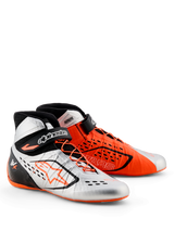 Alpinestars Tech-1 KX V3 - FIA, scarpe da karting, nero, argento e arancione fluo, design con colori spaiati con una scarpa argento e una arancione, caratterizzate da allacciatura asimmetrica e cinturini regolabili sulla caviglia, struttura leggera per prestazioni da gara