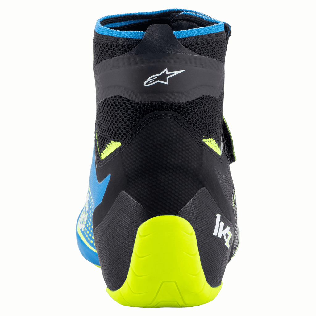 Scarpe Alpinestars Tech-1 KZ V2, scarpe da karting, nero, blu smalto e giallo fluo, vista posteriore con costruzione della tomaia in maglia, logo Alpinestars e supporto per il tallone giallo fluo brillante