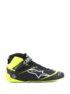 Alpinestars Tech-1 Z V3 Shoes FIA, scarpe da corsa, nero e giallo fluo, profilo laterale di calzatura motorsport alta, logo a stella bianco, design traforato per la traspirabilità, cinturino regolabile alla caviglia, suola sottile in gomma.