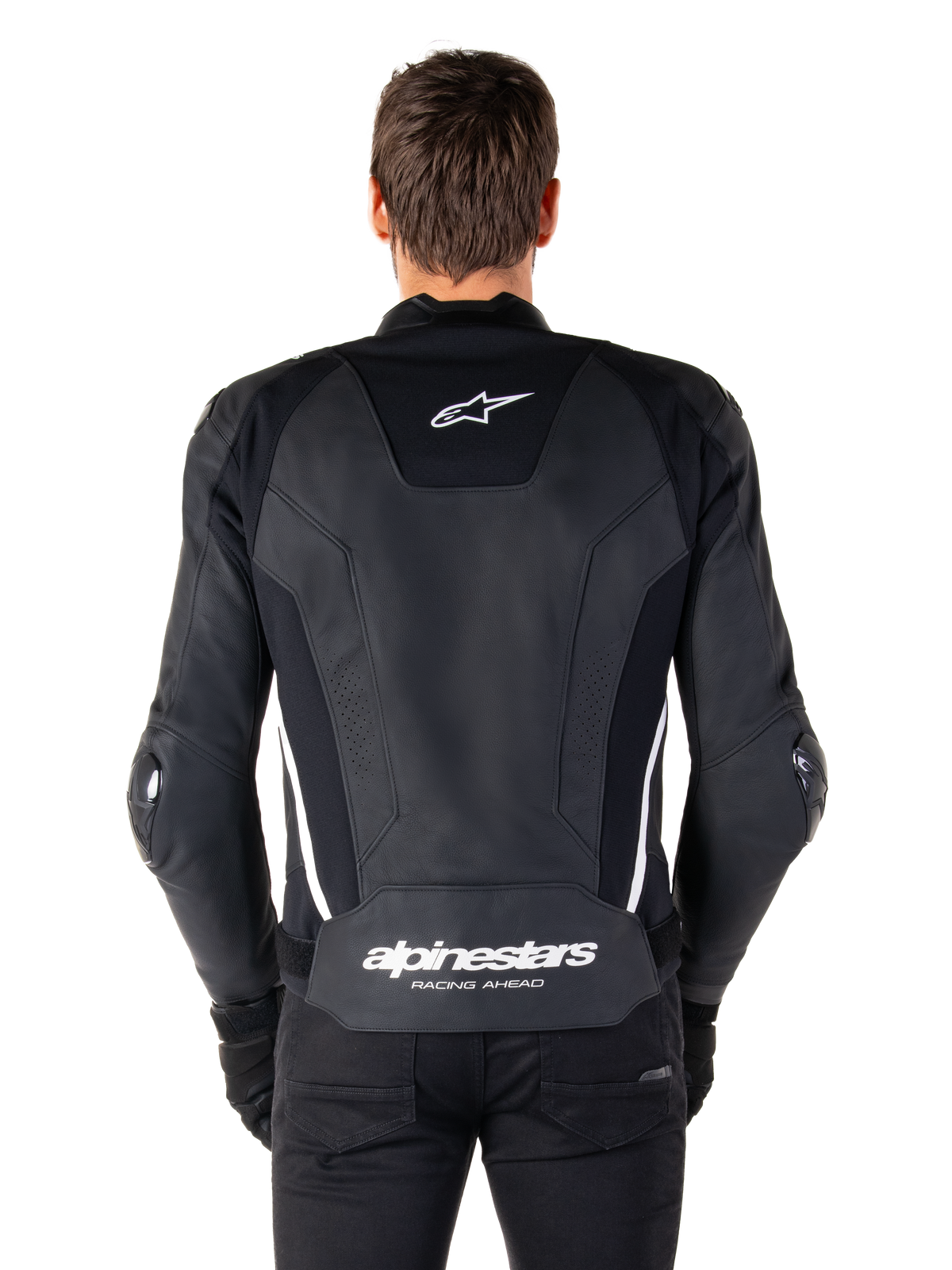 Vista posteriore della giacca in pelle Alpinestars Missile V3 in nero e bianco, con logo Alpinestars a stella sulla parte superiore della schiena e marchio sulla zona lombare, strisce verticali bianche e slider esterni sui gomiti, giacca sportiva da corsa in pelle premium.
