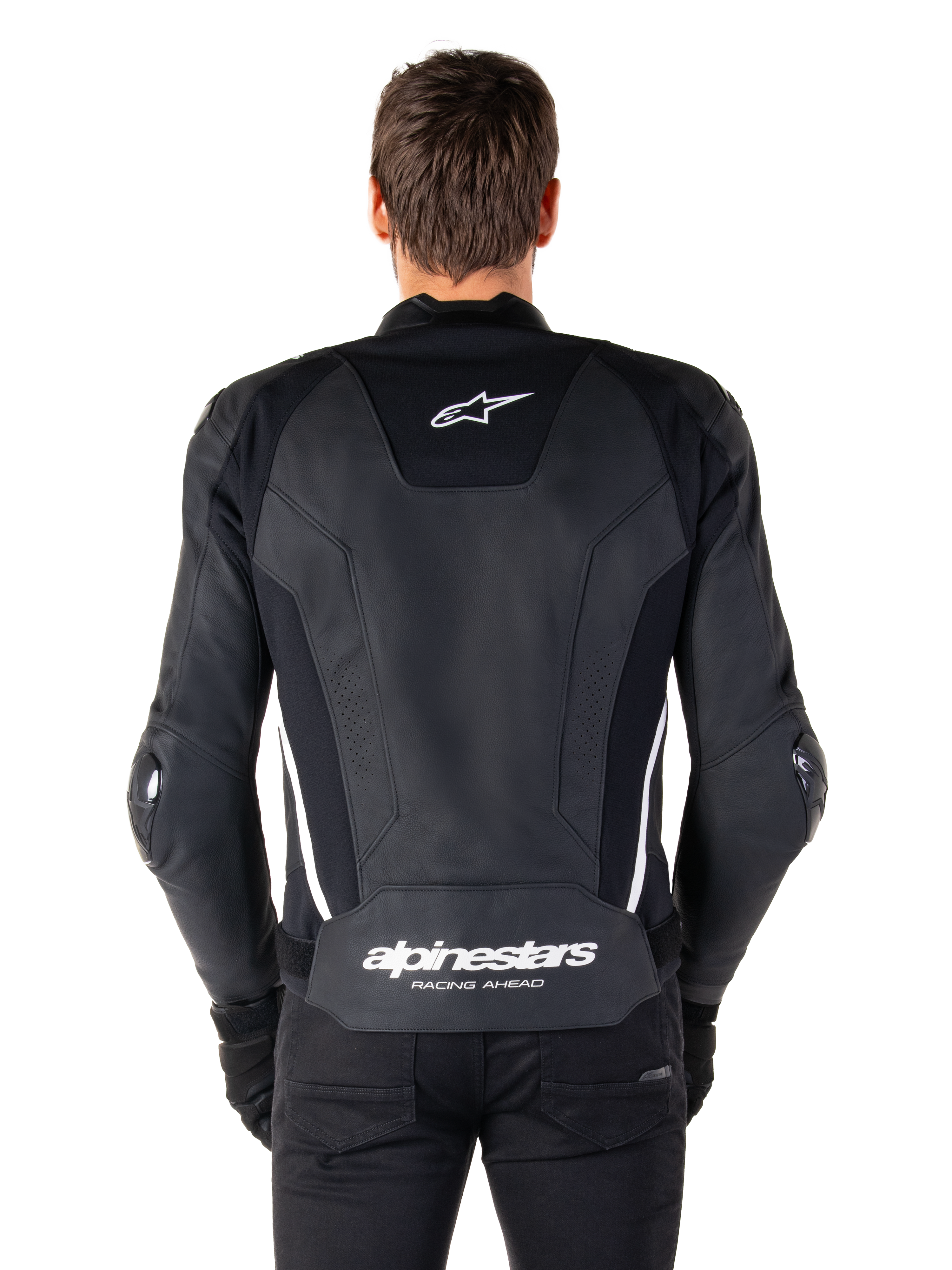 Vista posteriore della giacca in pelle Alpinestars Missile V3 in nero e bianco, con logo Alpinestars a stella sulla parte superiore della schiena e marchio sulla zona lombare, strisce verticali bianche e slider esterni sui gomiti, giacca sportiva da corsa in pelle premium.