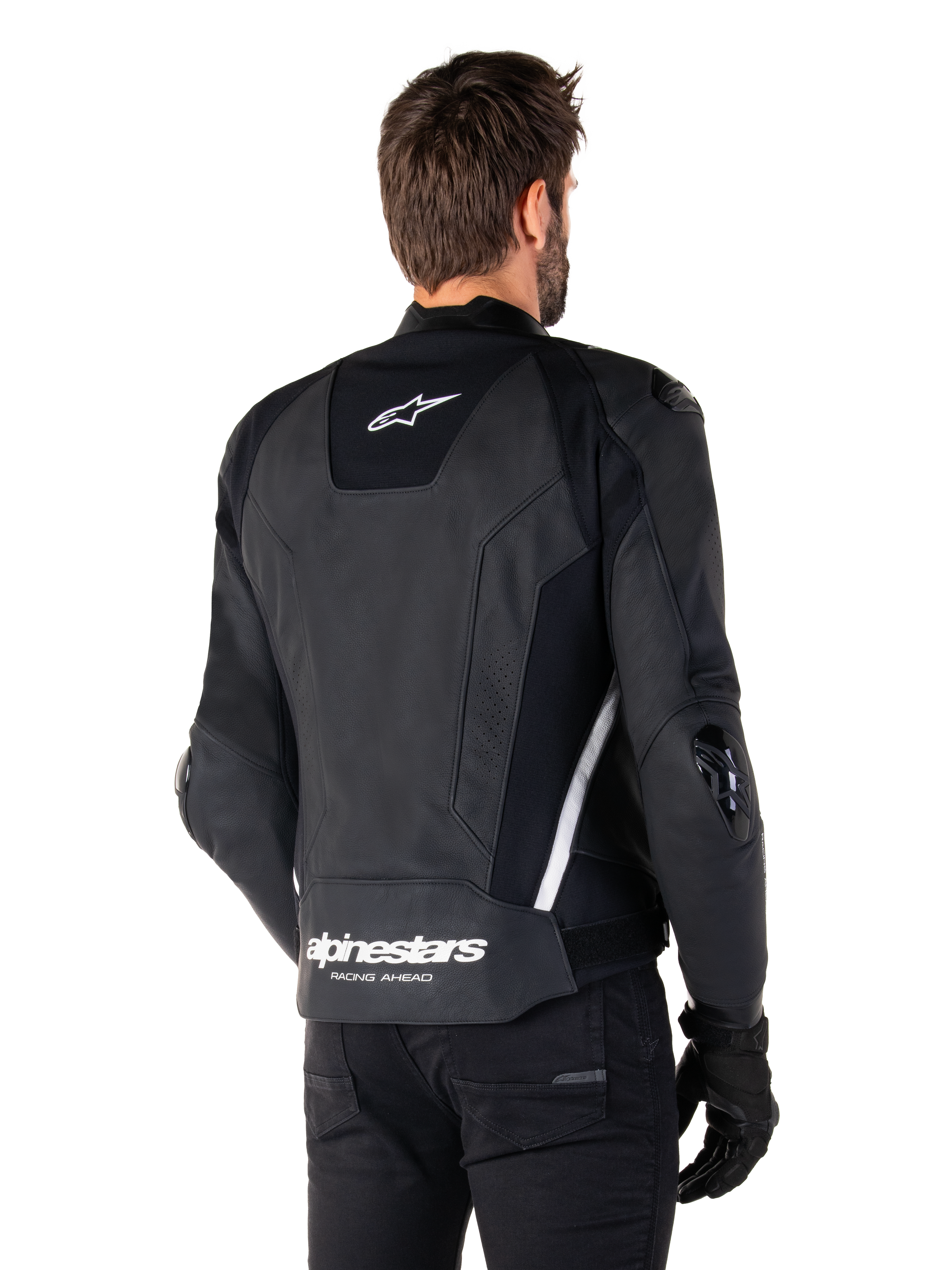 Giacca in pelle Alpinestars Missile V3, vista posteriore, nero e bianco, con logo a stella Alpinestars sulla parte superiore della schiena e scritta sulla parte inferiore, slider protettivi su gomiti e spalle, abbigliamento da corsa in pelle premium