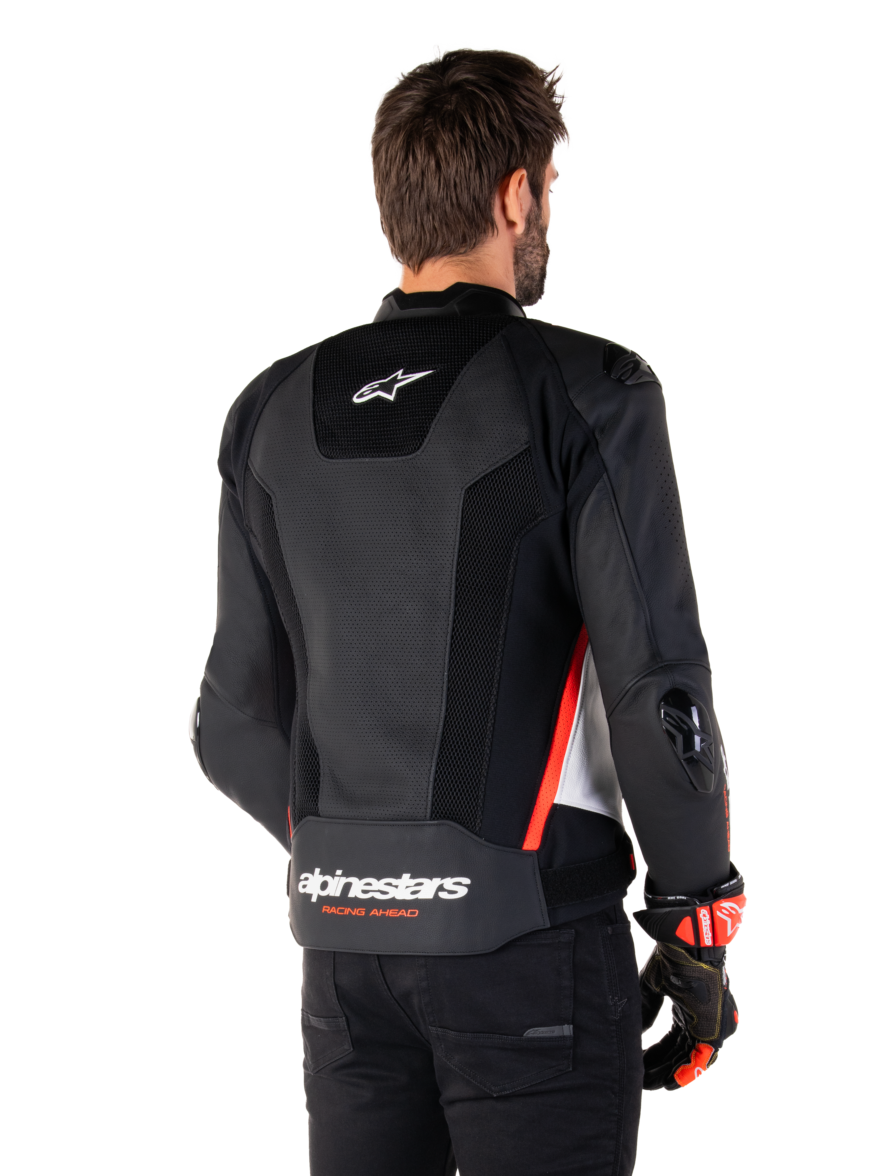 Alpinestars Missile V3 Airflow Leather Jacket, vista posteriore, nero, bianco e rosso fluo, con ampie perforazioni per il raffreddamento, slider esterni DFS su spalle e gomiti e logo Alpinestars sulla parte bassa della schiena.