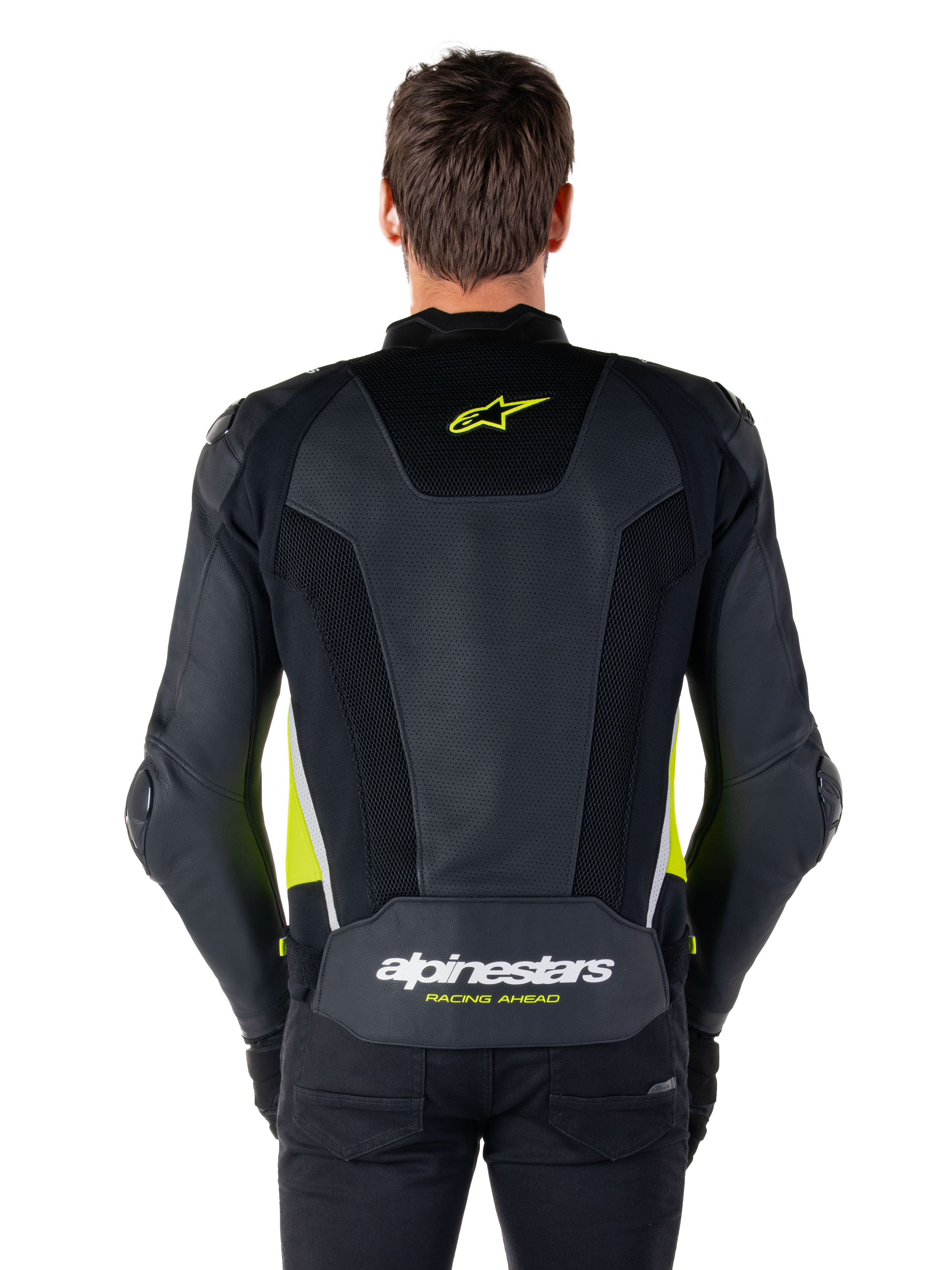 Giacca in pelle Alpinestars Missile V3 Airflow, vista posteriore, nero con accenti giallo fluo e bianco, ampi pannelli in pelle traforata per la ventilazione, branding Alpinestars sulla parte superiore e inferiore della schiena, giacca sportiva da moto ispirata alle corse