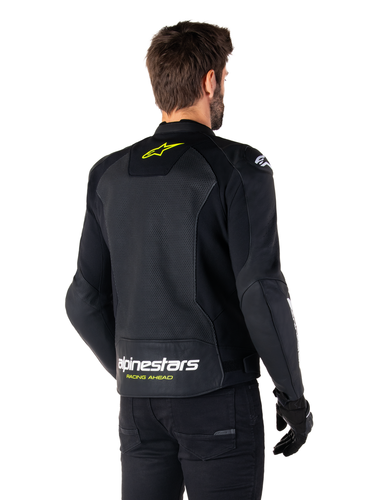 Giacca in pelle Alpinestars Faster V3 Airflow, nero, bianco e giallo fluo, vista posteriore, con un ampio pannello posteriore in pelle traforata per la ventilazione, logo a stella giallo sul colletto e marchio Alpinestars bianco con scritta 'Racing Ahead' gialla sull'orlo inferiore, abbigliamento tecnico da moto