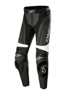 Alpinestars Stella Missile V3 Leather Pants, pantaloni moto racing da donna, nero e bianco, con pannelli a fisarmonica sopra le ginocchia, slider integrati con logo Alpinestars, dettagli bianchi e vestibilità aerodinamica per guida sportiva e in pista.