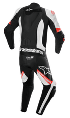 Tuta in pelle intera Alpinestars Missile V2 Ward, tuta da moto, nero, bianco e rosso fluo, vista posteriore con gobba aerodinamica, logo Tech-Air Ready sulla parte bassa della schiena, zone elasticizzate a fisarmonica e branding Alpinestars evidente su gambe e schiena