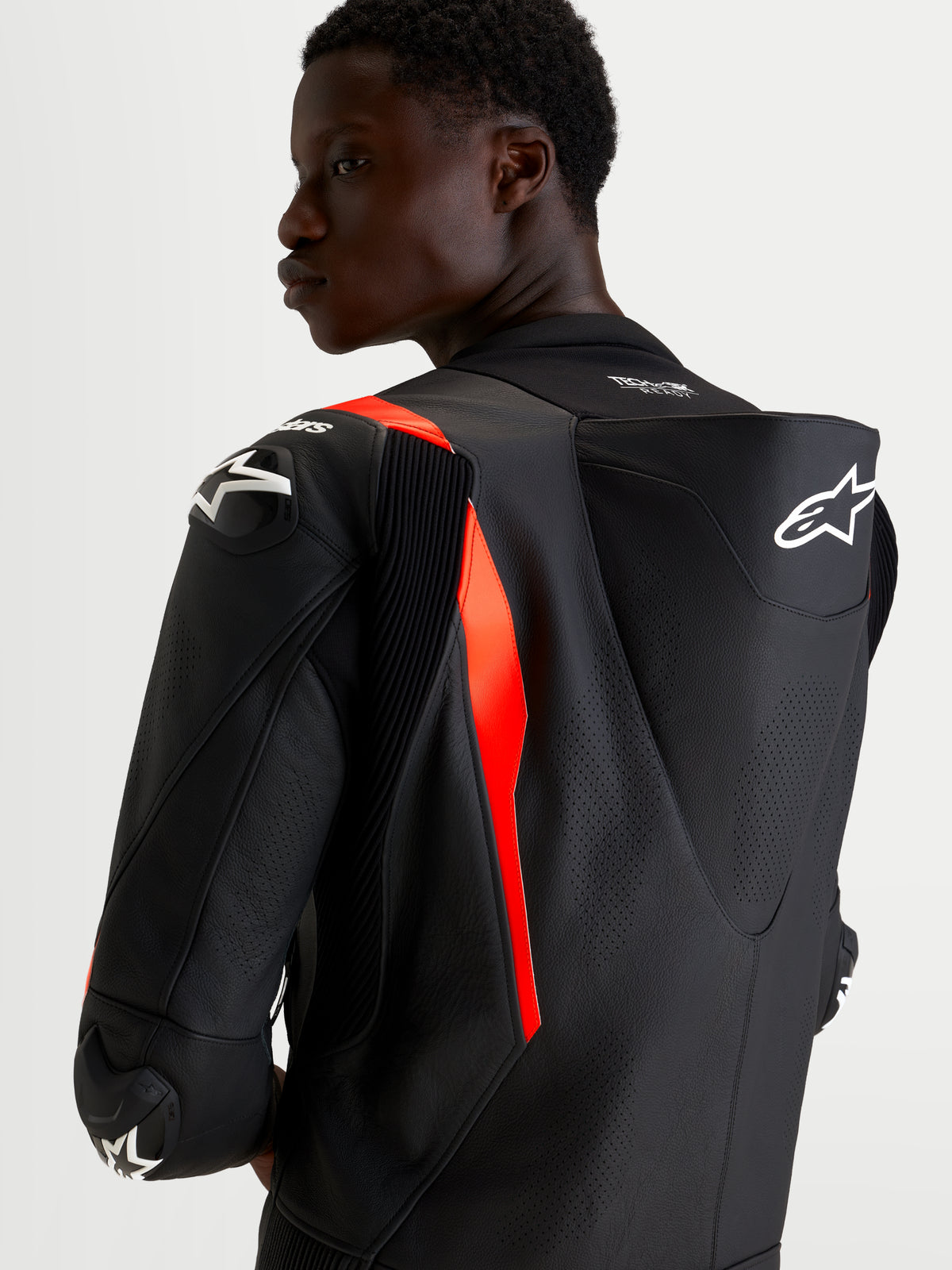 Alpinestars Missile V3 Tuta in pelle da moto 2 pezzi, nero e rosso fluo, da uomo, con gobba aerodinamica e protezione spalla DFS, vista posteriore