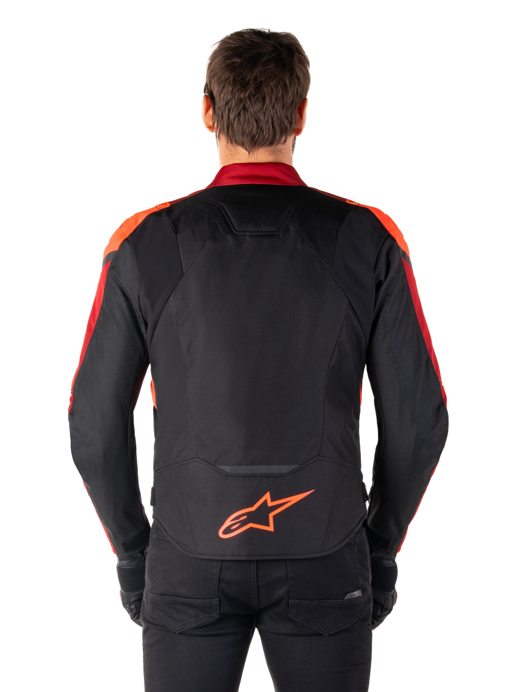 Alpinestars Giacca T-Jaws V4 Waterproof, vista posteriore, nero con dettagli rosso fluo e rosso scuro, logo arancione sulla parte bassa della schiena, pannello posteriore allungato per una maggiore copertura durante la guida, giacca da moto sportiva in tessuto