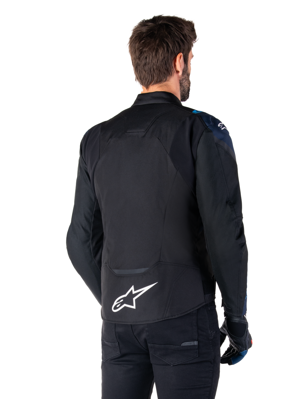 Alpinestars T-Jaws V4 Waterproof Jacket, vista posteriore, nero con dettagli Dark Blue e Blithe Blue, logo a stella bianco sulla parte bassa della schiena, silhouette sportiva, indossata con pantaloni neri e guanti da moto
