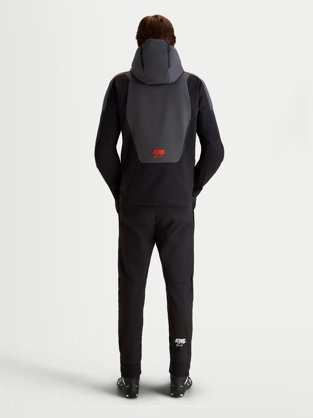 Alpinestars Aeroshell Wp Giacca, giacca da moto impermeabile da uomo in nero e grigio scuro, vista posteriore con cappuccio integrato e logo rosso Alpinestars