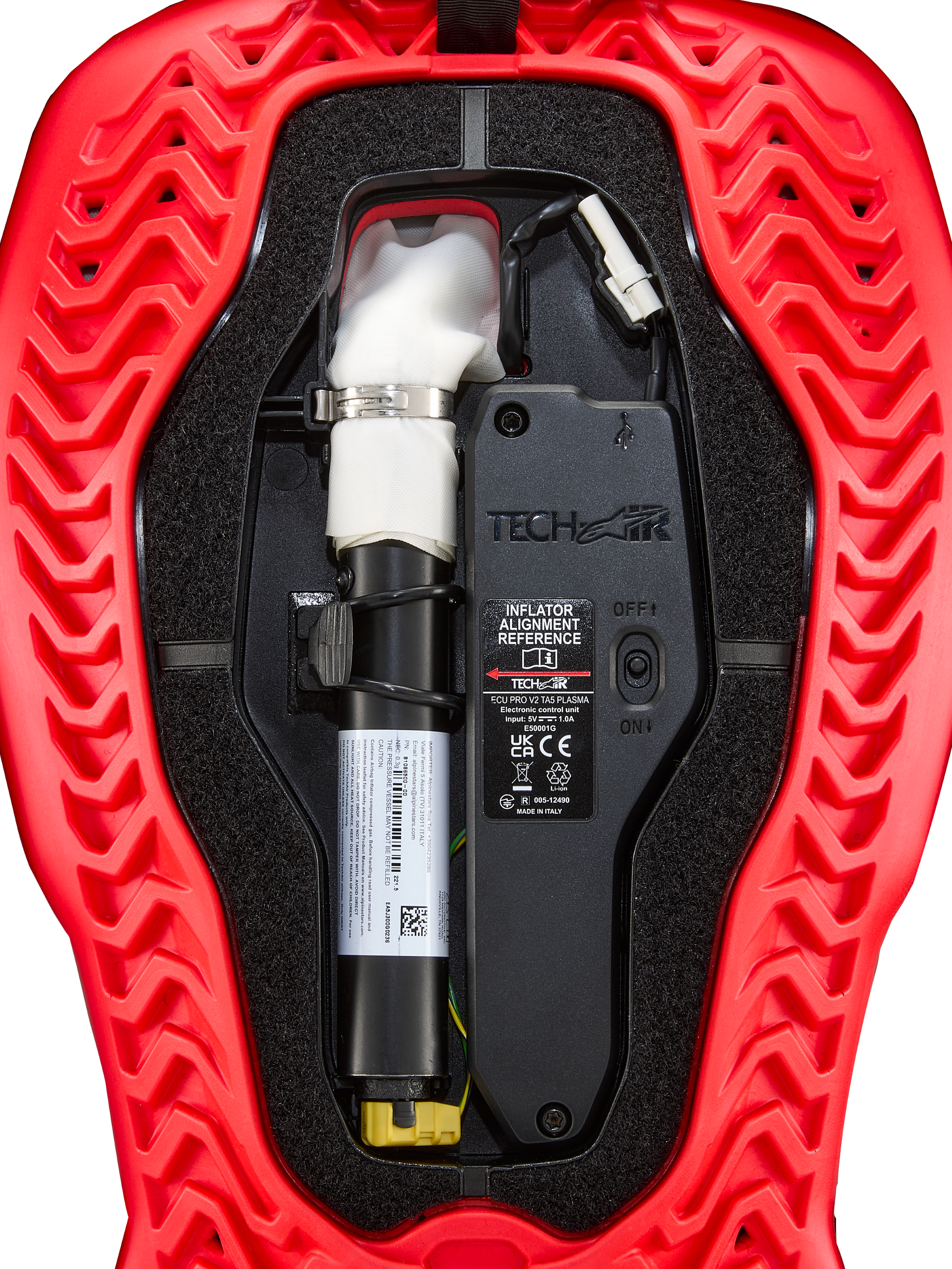 Alpinestars Bomboletta Di Ricambio Per Airbag Tech-Air® 5 Plasma, centralina ECU nera e gonfiatore bianco in un guscio rosso scanalato, accessorio airbag da moto.