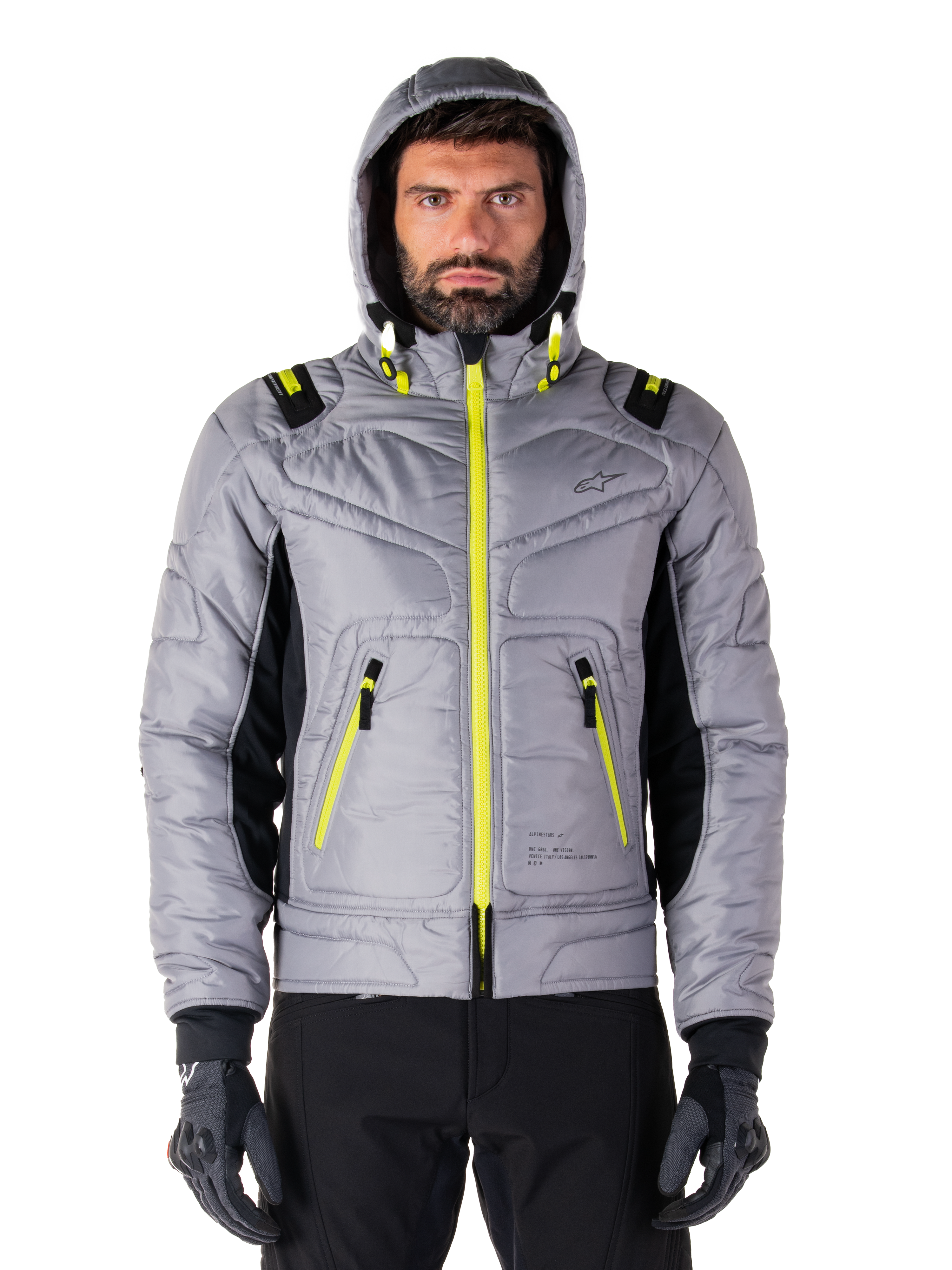 Giacca impermeabile Alpinestars Mohobbs, giacca bomber da moto, Lunar Gray e Lime Punch, design trapuntato con cerniere e dettagli del cappuccio giallo neon brillante, stile urban moto streetwear moderno.